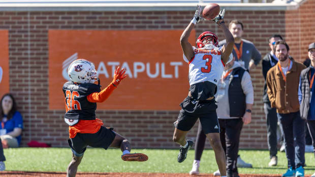 Jan 30, 2024; Mobile, AL, USA; American wide reciever Jamari Thrash of Louisville (3) grabs a pass with American defensive back Jaylin Simpson of Auburn (36) defending during practice for the American team at Hancock Whitney Stadium. Mandatory Credit: Vasha Hunt-USA TODAY Sports  